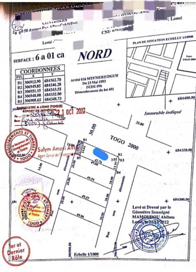 1 lot avec titre foncier en cours au bord du goudron